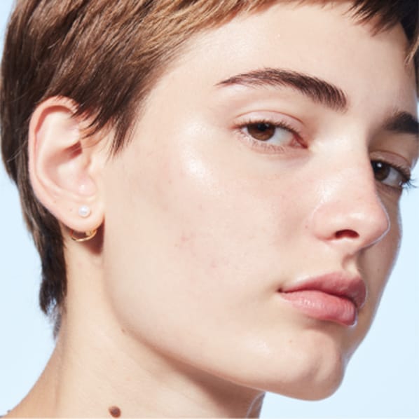Model shot focusing on natural, radiant skincare